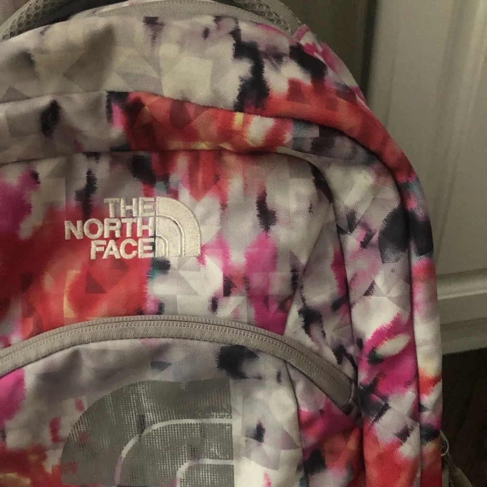 The North Face Pink Orange and Gray Floral Print Backpack